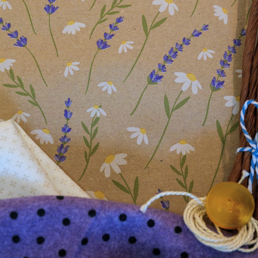 DIY fabric-and-paper craft kit materials with Lavender & Daisies floral paper, fabrics, raffia, button and string
